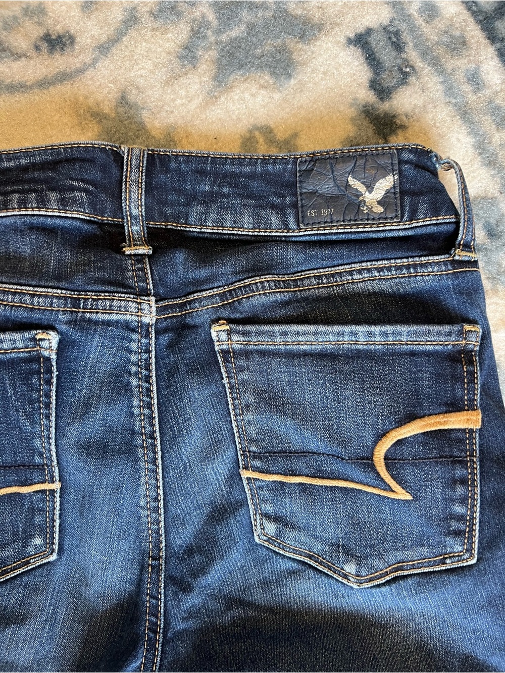 American Eagle Outfitters Dark Blue Skinny Jeans with Tan Stitching